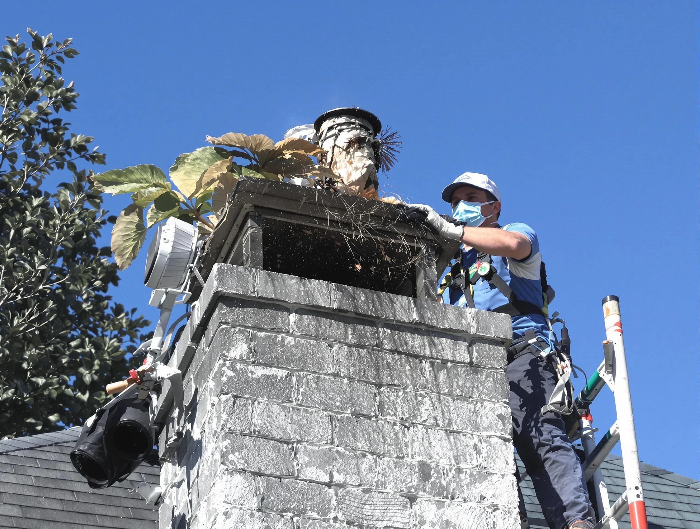 Youngtown Chimney Sweep specialist performing chimney cleaning in Youngtown, AZ